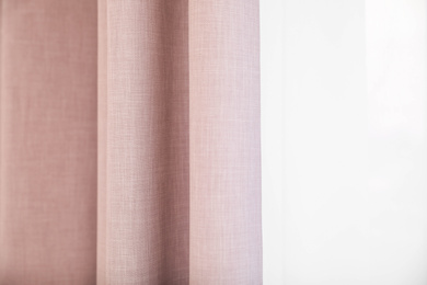 Window with elegant curtains indoors, closeup view