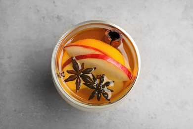 Aromatic white mulled wine on light grey table, top view