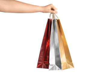 Woman holding paper shopping bags on white background, closeup