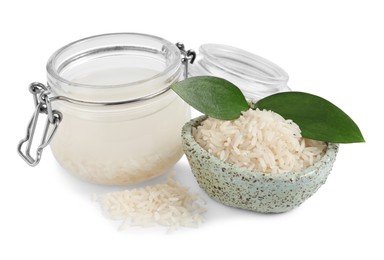 Homemade natural rice water and grains on white background