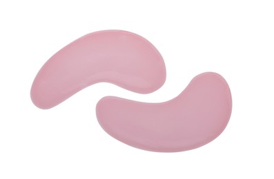 Photo of Pink under eye patches on white background, top view. Cosmetic product