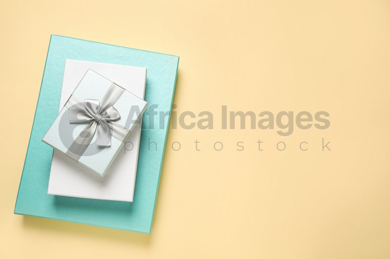 Beautiful gift boxes on beige background, top view. Space for text