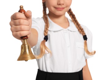 Closeup view of pupil with school bell on white background