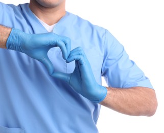 Photo of Doctor making heart with hands on white background, closeup