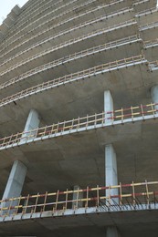 Construction site with unfinished building, low angle view