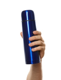 Man holding blue thermos on white background, closeup