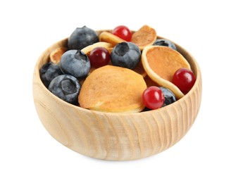 Delicious mini pancakes cereal with berries on white background