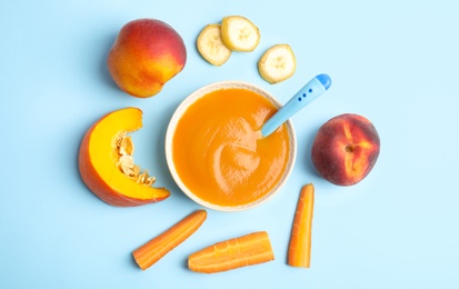 Flat lay composition with healthy baby food and ingredients on light blue background