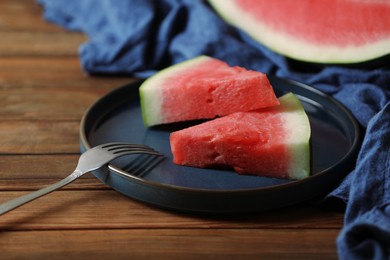Sliced fresh juicy watermelon served on wooden table, closeup