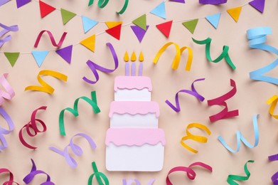 Photo of Birthday party. Paper birthday cake and confetti on beige background, flat lay