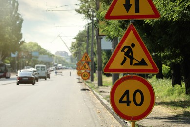 Traffic signs on city street. Road repair