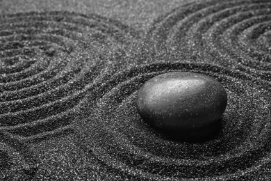 Black sand with stone and beautiful pattern. Zen concept