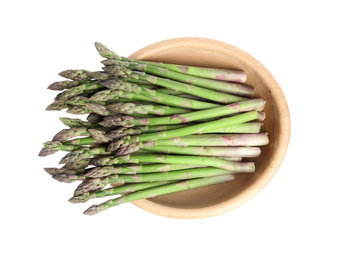 Fresh raw asparagus in wooden bowl isolated on white, top view