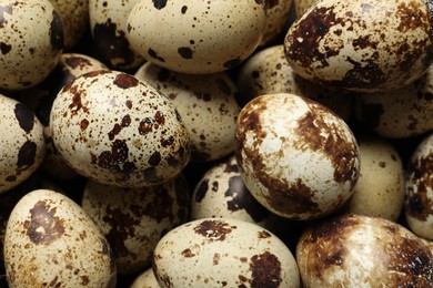 Photo of Many fresh quail eggs as background, closeup