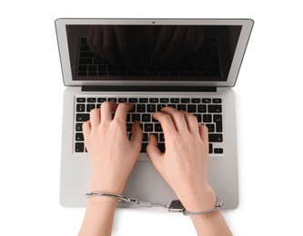 Photo of Woman in handcuffs typing on laptop against white background, top view. Internet addiction