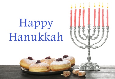 Happy Hanukkah. Silver menorah, sufganiyot and dreidels on wooden table