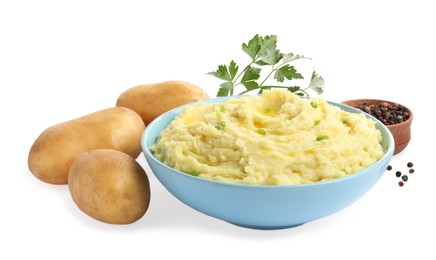 Bowl of tasty mashed potatoes with ingredients on white background
