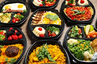 Lunchboxes with different meals on table. Healthy food delivery
