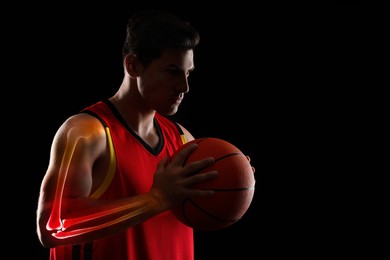 Image of Digital composite of highlighted bones and basketball player with ball on black background