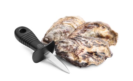 Fresh raw oysters and knife on white background