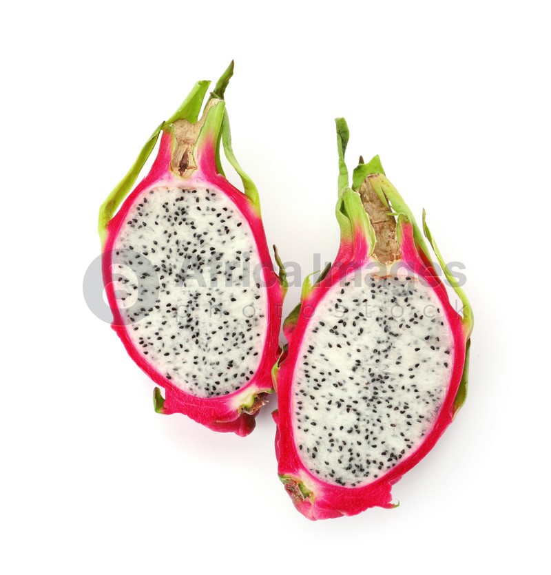 Photo of Halves of delicious dragon fruit (pitahaya) on white background, top view