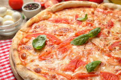 Photo of Delicious pizza Margherita on table, closeup view
