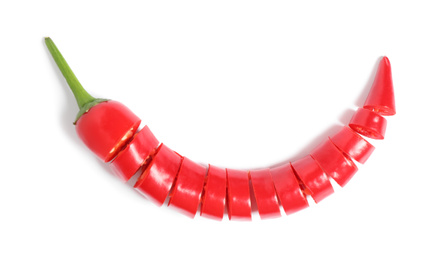 Photo of Cut red hot chili pepper on white background, top view