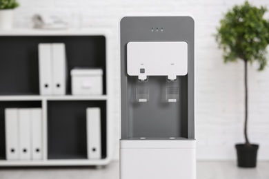Modern water cooler in stylish office interior
