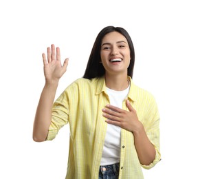 Happy woman waving to say hello on white background