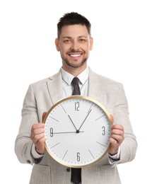 Happy businessman holding clock on white background. Time management