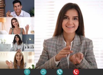 Coworkers using video chat to work remotely. People on display, views through camera