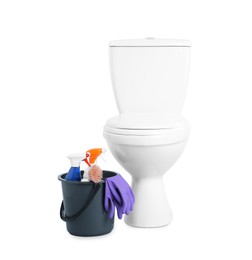 Toilet bowl and bucket with cleaning supplies on white background