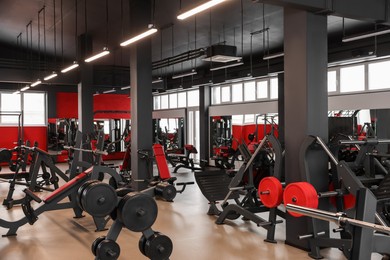 Photo of Spacious gym with professional equipment and mirrors