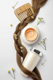 Flat lay composition with natural cosmetic products and hair braid on white background