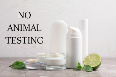 Cosmetic products and text NO ANIMAL TESTING on light background