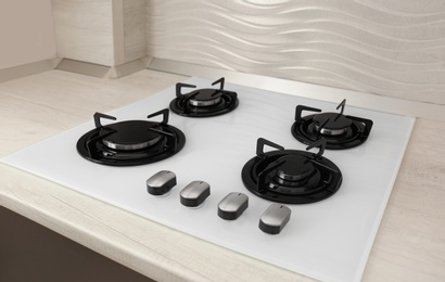 Photo of Modern built-in gas cooktop. Kitchen appliance