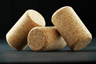 Corks of wine bottles on grey table, closeup