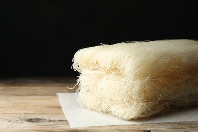 Photo of Block of rice noodles on wooden table, closeup