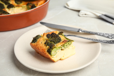 Tasty broccoli casserole served on grey marble table