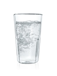 Pouring soda water into glass on white background