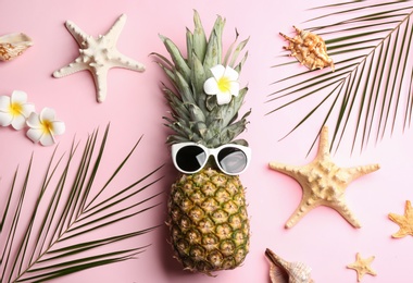 Photo of Flat lay composition with pineapple on pink background. Creative concept