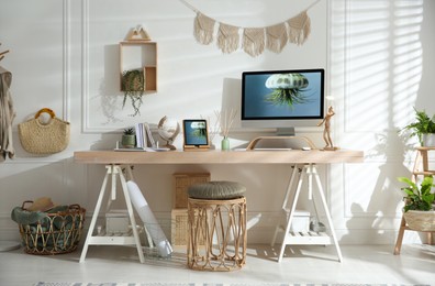 Stylish home office interior with comfortable workplace
