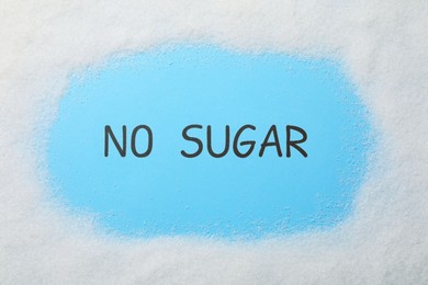 Words No Sugar on light blue background, top view