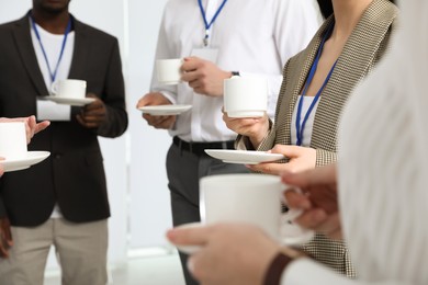 Photo of Group of people during coffee break, closeup