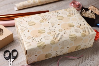 Beautifully wrapped gift boxes on wooden table
