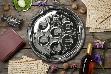 Flat lay composition with symbolic Passover (Pesach) items on wooden background