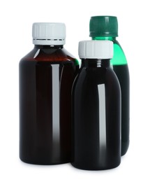 Bottles of cough syrup on white background