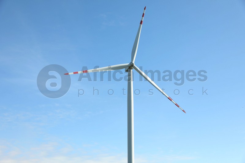 Modern wind turbine against blue sky. Alternative energy source