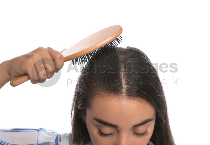 Photo of Woman with hair loss problem on white background, closeup. Trichology treatment