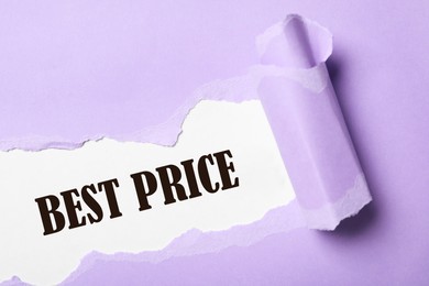 Phrase Best Price on white background, view through torn violet paper